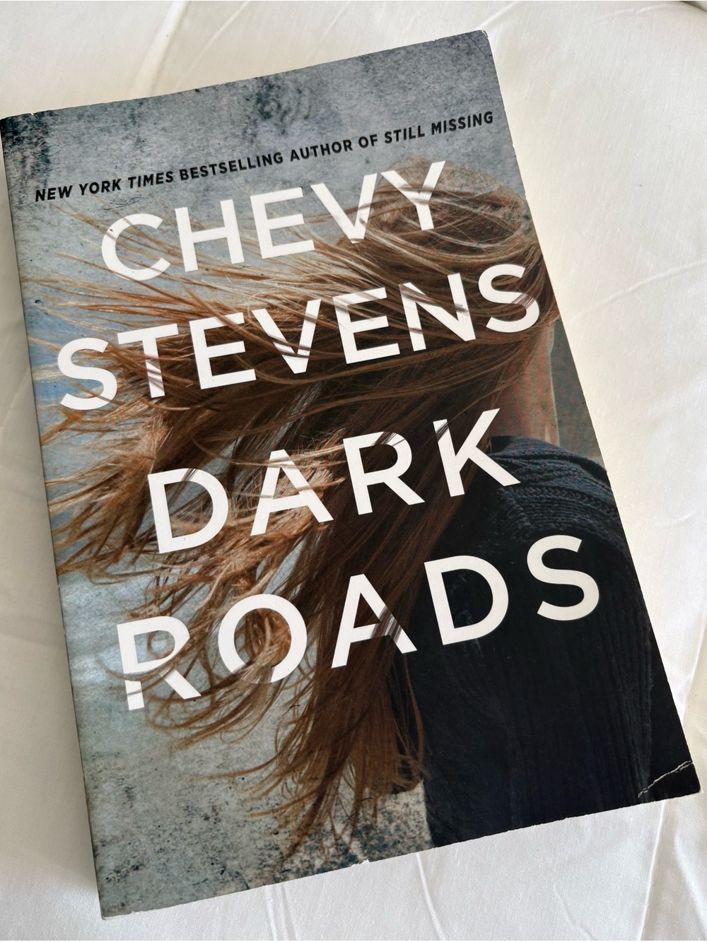 "Dark Roads" By- Chevy Stevens, Paperback Book - Brown/Black Cover